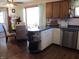 Kitchen dining area with wooden table, hardwood floors, and view through a large window to the living room at 1459 S Josephine St, Martinsville, IN 46151