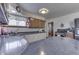 Galley-style kitchen featuring modern appliances, neutral countertops, and ample cabinet space at 1459 S Josephine St, Martinsville, IN 46151