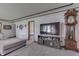 Spacious living room with a TV, storage console, and grandfather clock at 1459 S Josephine St, Martinsville, IN 46151