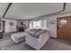 Cozy living room with a stone fireplace, plush seating, and neutral decor at 1459 S Josephine St, Martinsville, IN 46151