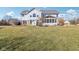 A backyard featuring a well-maintained lawn and a home with a sunroom addition at 14936 Newport Dr, Westfield, IN 46074