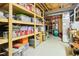 Organized basement storage with wooden shelving and various containers at 14936 Newport Dr, Westfield, IN 46074