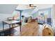 Bonus room with plenty of space, natural light, ceiling fan, and hardwood flooring at 14936 Newport Dr, Westfield, IN 46074