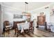 Elegant dining room featuring classic furnishings, hardwood floors, and a stylish chandelier, perfect for gatherings at 14936 Newport Dr, Westfield, IN 46074