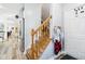 Entryway with wood staircase, gray walls, access to kitchen, and front door at 14936 Newport Dr, Westfield, IN 46074