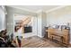 Warm entryway showcasing wood floors and staircase, seamlessly connecting to living and dining spaces at 14936 Newport Dr, Westfield, IN 46074