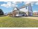 Home exterior with a screened in porch, lush green lawn, and mature landscaping at 14936 Newport Dr, Westfield, IN 46074