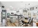 Open kitchen with white cabinets, granite counters, stainless appliances, and eat-in dining area at 14936 Newport Dr, Westfield, IN 46074