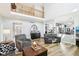 Spacious living room with high ceilings, hardwood floors, and an open layout perfect for entertaining and relaxation at 14936 Newport Dr, Westfield, IN 46074