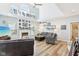 Bright living room with fireplace, hardwood floors, and vaulted ceiling with clerestory window at 14936 Newport Dr, Westfield, IN 46074
