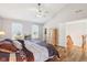 Bright main bedroom with ceiling fan, wooden floors, a walk-in closet and lots of natural light at 14936 Newport Dr, Westfield, IN 46074
