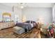 Vaulted main bedroom features a seating area, wooden floors, neutral paint, and a ceiling fan at 14936 Newport Dr, Westfield, IN 46074
