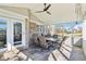 Spacious sunroom featuring a ceiling fan, brick accents, and patio seating at 14936 Newport Dr, Westfield, IN 46074