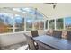 Inviting sunroom with large windows, a ceiling fan, and patio furniture at 14936 Newport Dr, Westfield, IN 46074