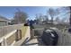 Private backyard with a wooden deck, well-maintained lawn, and secure fencing at 1505 S Alabama St, Indianapolis, IN 46225