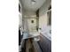 Bathroom featuring a tiled shower-tub, dark wood flooring, and a modern sink at 1505 S Alabama St, Indianapolis, IN 46225