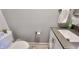 Neutral half-bathroom with a modern vanity and fixtures; great for guests at 1505 S Alabama St, Indianapolis, IN 46225