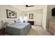 Bright bedroom with a king bed, neutral decor, and natural light from windows at 1505 S Alabama St, Indianapolis, IN 46225