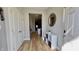 Inviting entryway with wood-look flooring, decor shelving, and interior view at 1505 S Alabama St, Indianapolis, IN 46225