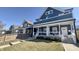 Charming two-story home featuring a welcoming front porch and well-maintained lawn at 1505 S Alabama St, Indianapolis, IN 46225