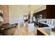Well-equipped kitchen with stainless steel appliances, island, and brick accent wall at 1505 S Alabama St, Indianapolis, IN 46225