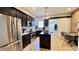 Modern kitchen with stainless steel appliances, granite counters, and exposed brick wall at 1505 S Alabama St, Indianapolis, IN 46225