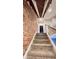 Exposed brick wall and modern staircase design create an urban look at 1505 S Alabama St, Indianapolis, IN 46225