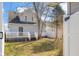 Spacious backyard features a wooden deck and partially fenced yard at 1714 Elm St, Columbus, IN 47201