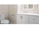 Bathroom featuring white vanity, modern fixtures, and toilet at 1714 Elm St, Columbus, IN 47201