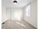 Light-filled bedroom features soft carpet, a flush mount light fixture, and one window with blinds at 1714 Elm St, Columbus, IN 47201