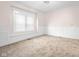 Bedroom offers a large window and molding, providing natural light and charm at 1714 Elm St, Columbus, IN 47201
