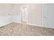 Spacious bedroom with neutral carpet, molding, and access to a full bath at 1714 Elm St, Columbus, IN 47201