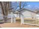 Wooden deck view of backyard with detached building and fenced yard at 1714 Elm St, Columbus, IN 47201