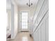 Bright foyer with tiled floor, white trim, and a staircase leading to the upper level at 1714 Elm St, Columbus, IN 47201