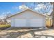 Two-car detached garage with a concrete driveway and two paneled garage doors at 1714 Elm St, Columbus, IN 47201