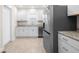 Contemporary kitchen featuring tile floors, stainless steel appliances, and bright cabinetry at 1714 Elm St, Columbus, IN 47201