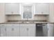 Beautiful kitchen with bright white cabinets, stainless steel appliances, and modern countertops at 1714 Elm St, Columbus, IN 47201