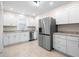 Modern kitchen featuring recessed lighting, tiled flooring, and stainless steel appliances at 1714 Elm St, Columbus, IN 47201