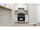 Updated kitchen with stainless steel oven/range, shaker cabinets, and tile flooring at 1714 Elm St, Columbus, IN 47201
