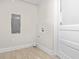 Utility room features tile floors and modern washer/dryer hookups at 1714 Elm St, Columbus, IN 47201