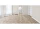 Spacious living room with plush carpet, built-in shelving, and plenty of natural light at 1714 Elm St, Columbus, IN 47201