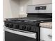 Close up shot of the stainless steel oven range and cooktop at 1714 Elm St, Columbus, IN 47201