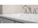 Close up of a white vanity with modern fixtures at 1714 Elm St, Columbus, IN 47201