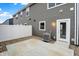 Backyard patio with gray siding and a white privacy fence at 19493 Grassy Branch Rd, Westfield, IN 46074