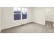 Neutral bedroom with natural light, carpeted flooring, and an open closet at 19493 Grassy Branch Rd, Westfield, IN 46074