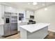 Well-equipped kitchen showcasing a central island and state-of-the-art stainless steel appliances at 19493 Grassy Branch Rd, Westfield, IN 46074