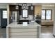 Modern kitchen with stainless steel appliances, quartz countertops, and custom cabinets at 19533 Justin Morgan Dr, Westfield, IN 46074