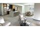 Bright, open kitchen with stainless steel appliances, island with seating, and a dining area at 19533 Justin Morgan Dr, Westfield, IN 46074