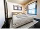 Serene bedroom with neutral tones, natural light, and traditional finishes at 2433 Indianapolis Ave, Indianapolis, IN 46208