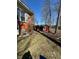 View of brick house and spacious shed on a well-maintained lawn at 28 Cambridge Ct, Anderson, IN 46012